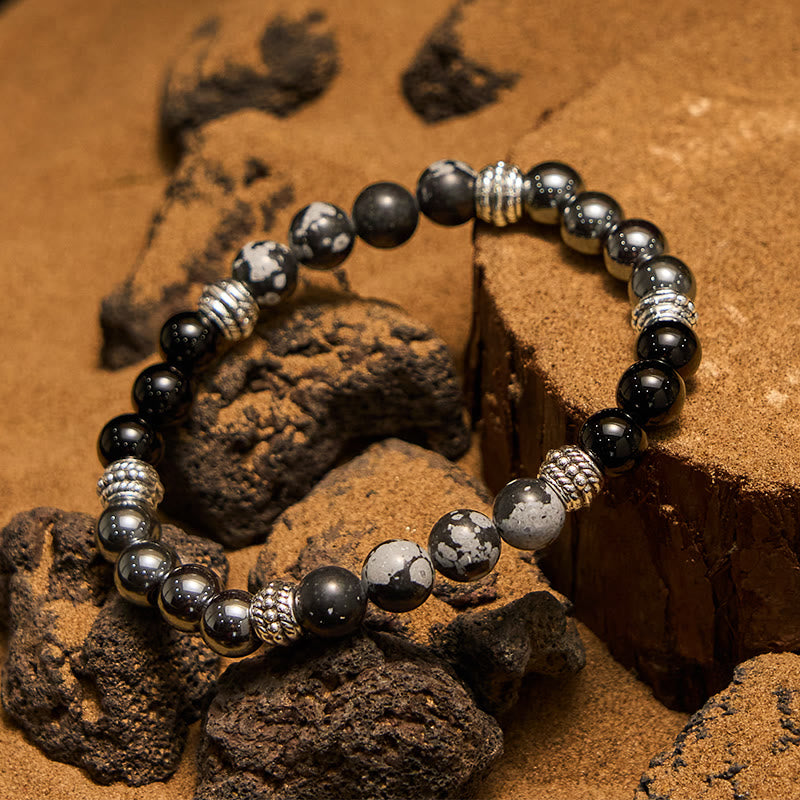 Pulsera para hombre con cuentas de hematita y obsidiana copo de nieve de Olivenorma