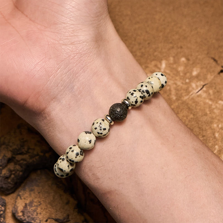Pulsera de cuentas de piedra de lava de jaspe dálmata natural de Olivenorma
