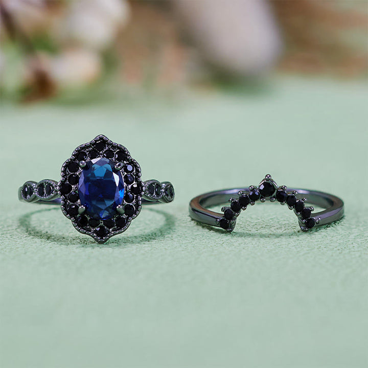 Conjunto nupcial floral con zafiro ovalado en oro negro de Olivenorma