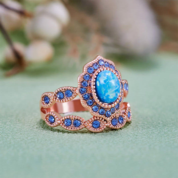 Juego de 2 anillos Olivenorma de oro rosa con zafiro y ópalo azul