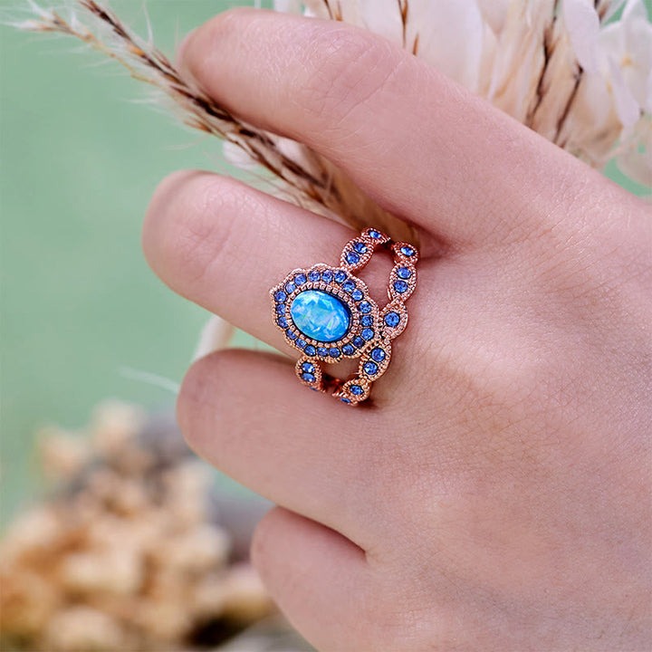 Juego de 2 anillos Olivenorma de oro rosa con zafiro y ópalo azul