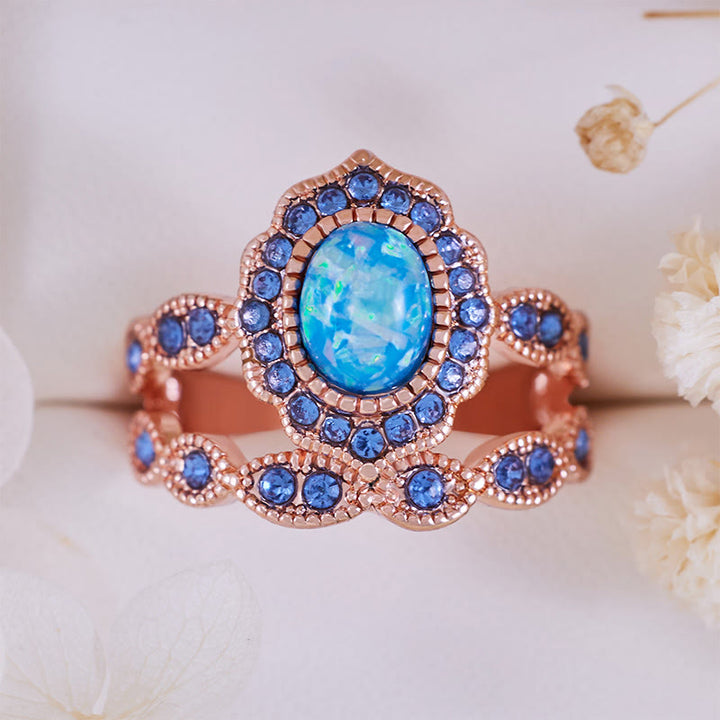 Juego de 2 anillos Olivenorma de oro rosa con zafiro y ópalo azul