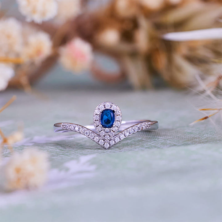 Anillo Olivenorma con corona en forma de lágrima y topacio azul