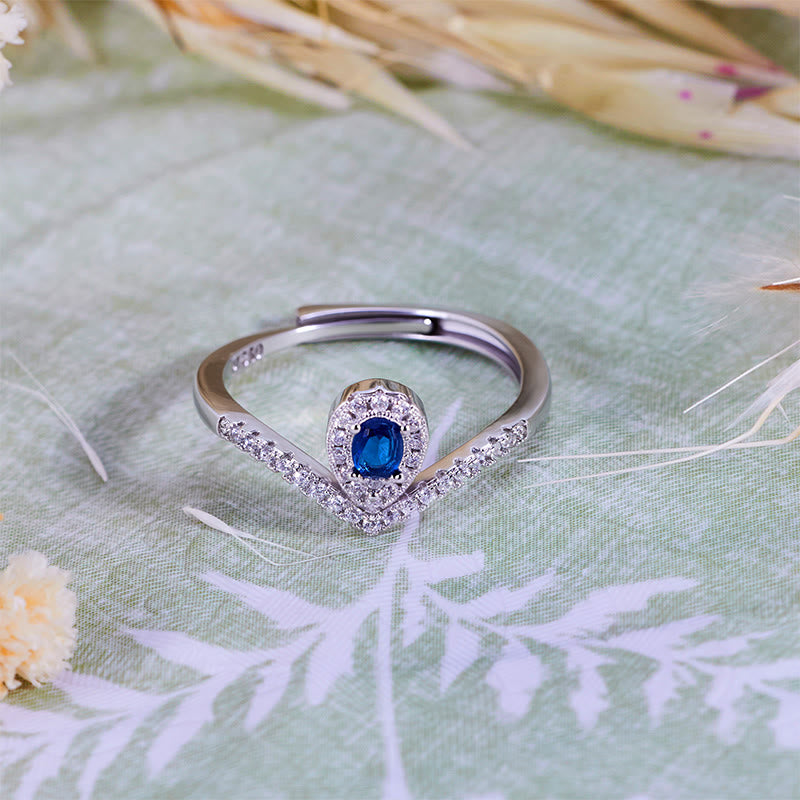 Anillo Olivenorma con corona en forma de lágrima y topacio azul