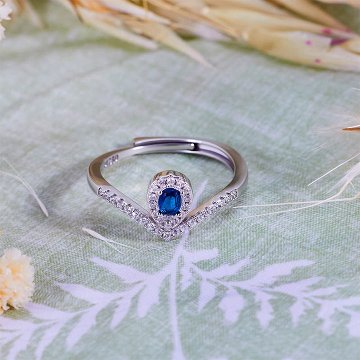 Anillo Olivenorma con corona en forma de lágrima y topacio azul