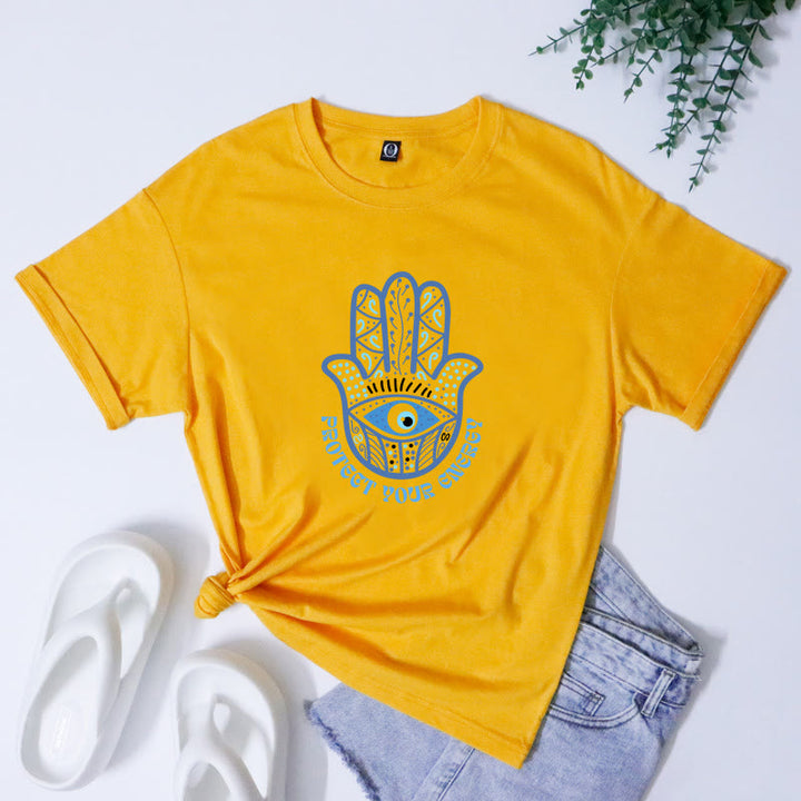 Camiseta con estampado de hamsa y ojo malvado de Olivenorma