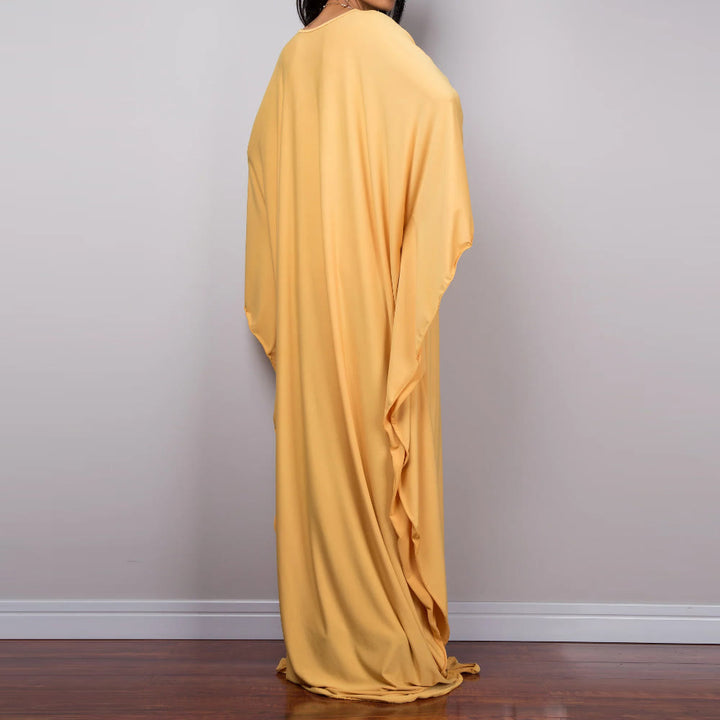Vestido caftán con diseño tejido y camisa de protección solar de Olivenorma Beach