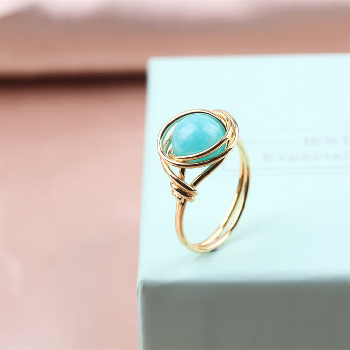 Anillo de cristal curativo envuelto en alambre