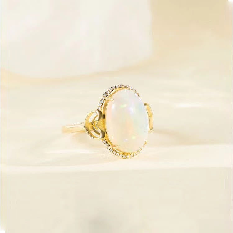 Anillo ajustable con diseño de amor en el costado y ópalo grande de Olivenorma 