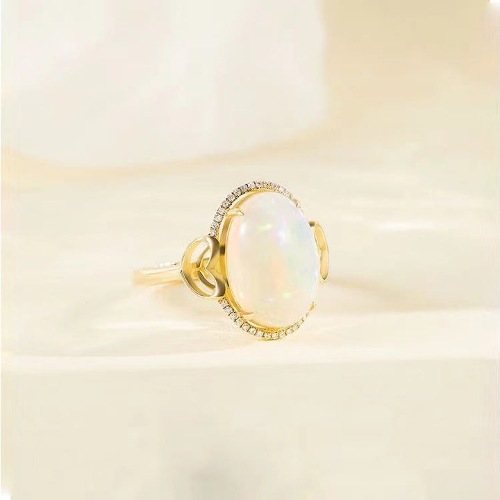 Anillo ajustable con diseño de amor en el costado y ópalo grande de Olivenorma 