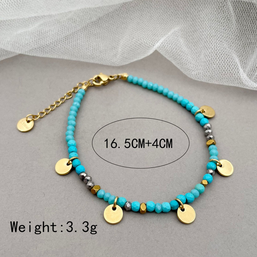 Pulsera con dijes de disco de titanio y cuentas de piedra natural de Olivenorma