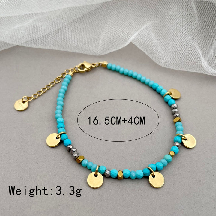 Pulsera con dijes de disco de titanio y cuentas de piedra natural de Olivenorma