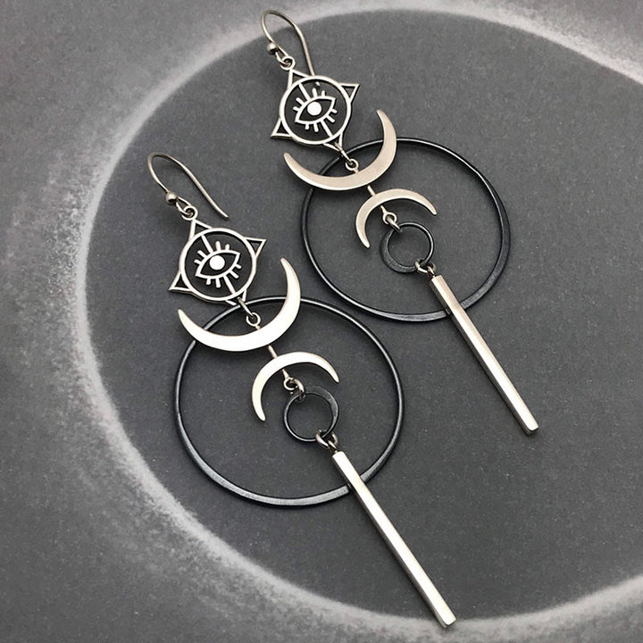 Pendientes largos con forma de media luna y forma de ojo de bruja con diseño geométrico de Olivenorma