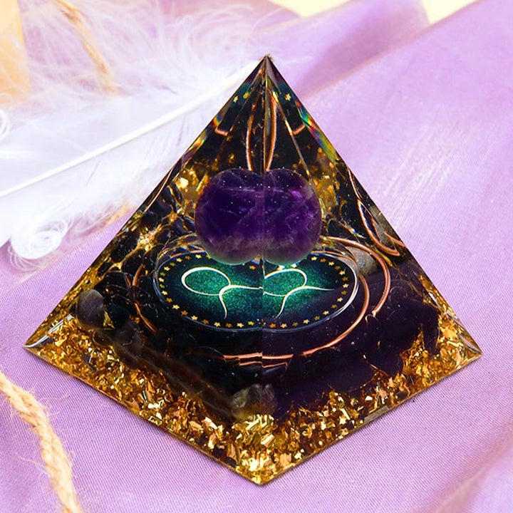 Pirámide de orgón del zodiaco Tauro con esfera de amatista y obsidiana de Olivenorma 