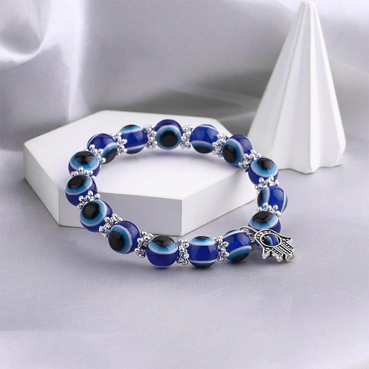 Pulsera curativa con símbolo de mal de ojo y hamsa