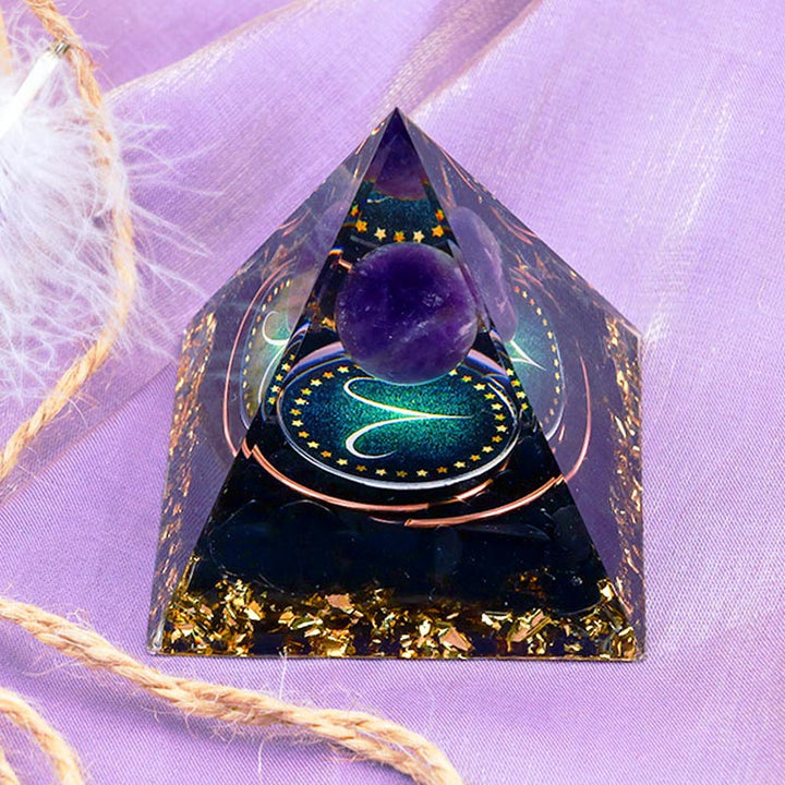 Pirámide de orgón del zodiaco Aries con esfera de amatista y obsidiana de Olivenorma 