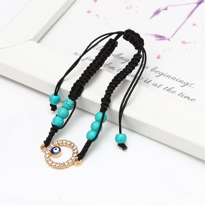 Pulsera trenzada ajustable con ojo malvado y circonita blanca y turquesa de Olivenorma 