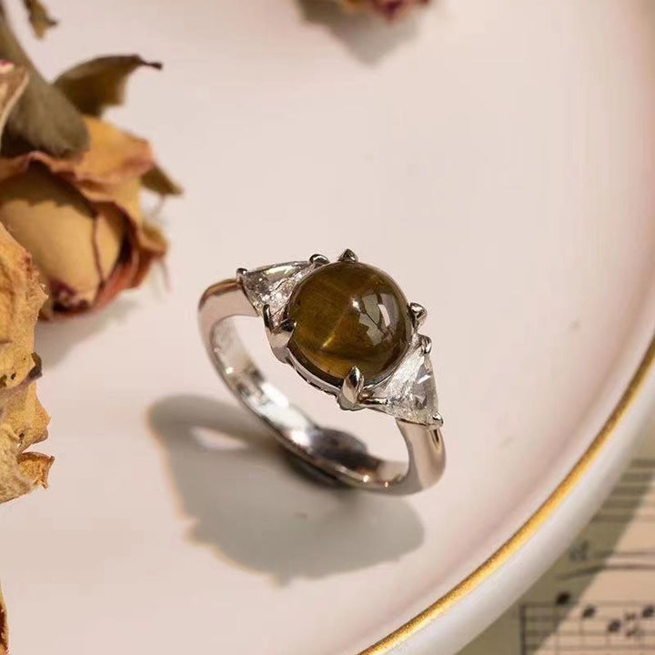 Anillo de piedra de ojo de gato verde dorado con cuatro garras de Olivenorma 
