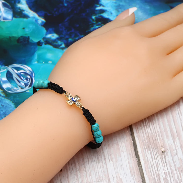 Pulsera trenzada ajustable con ojo malvado y circonita blanca y turquesa de Olivenorma 