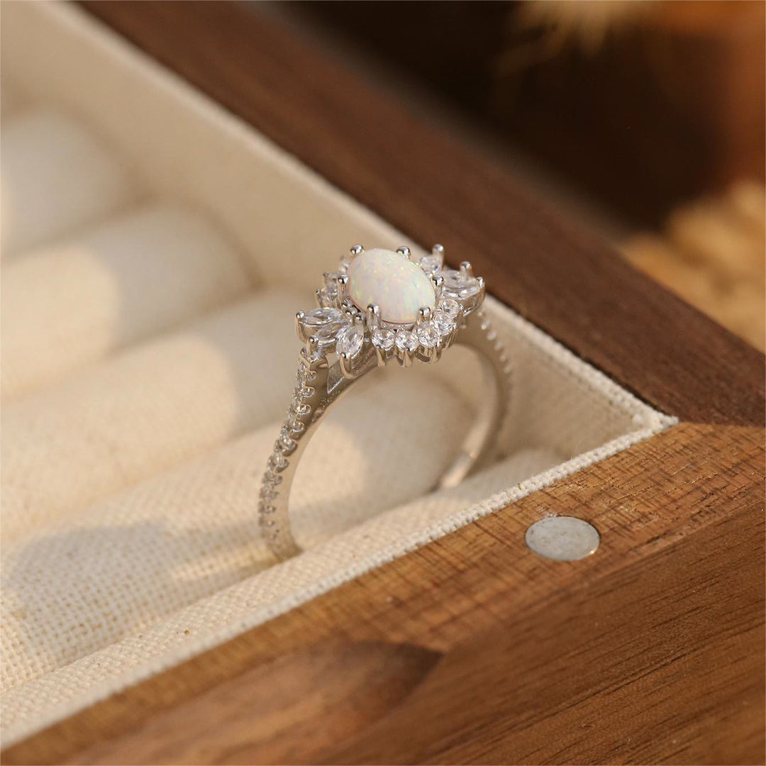 Anillo de plata 925 con diseño de girasol y ópalo azul blanco de Olivenorma 