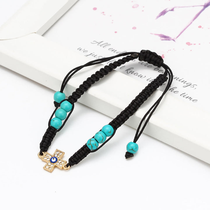 Pulsera trenzada ajustable con ojo malvado y circonita blanca y turquesa de Olivenorma 