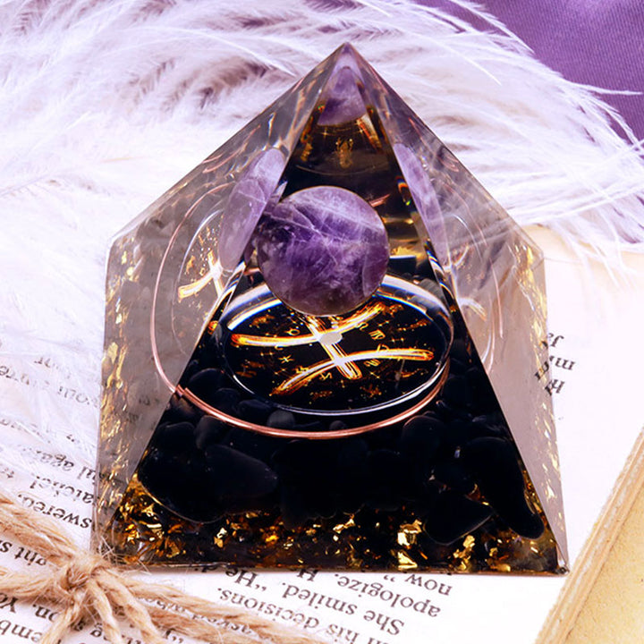 Pirámide de orgón del zodiaco Piscis con esfera de amatista y obsidiana de Olivenorma 