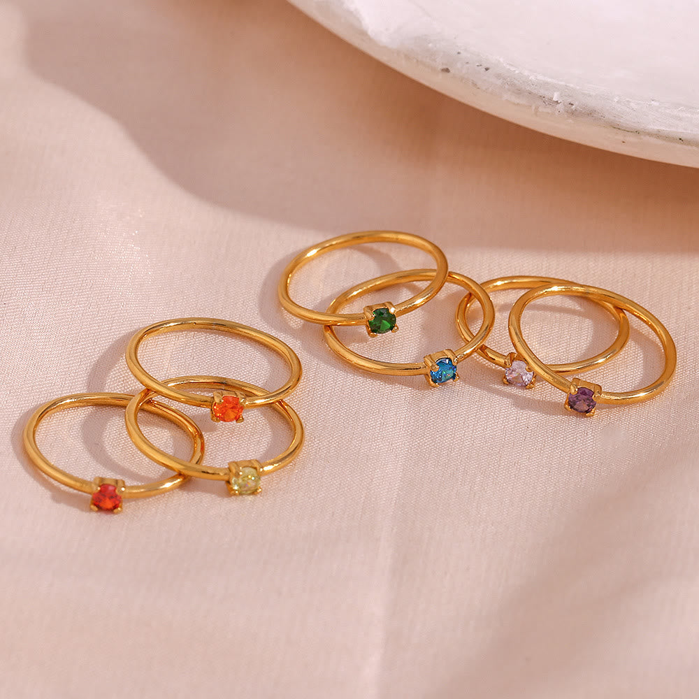 Anillo de acero inoxidable chapado en oro de 18 quilates con piedra natal simple de Olivenorma