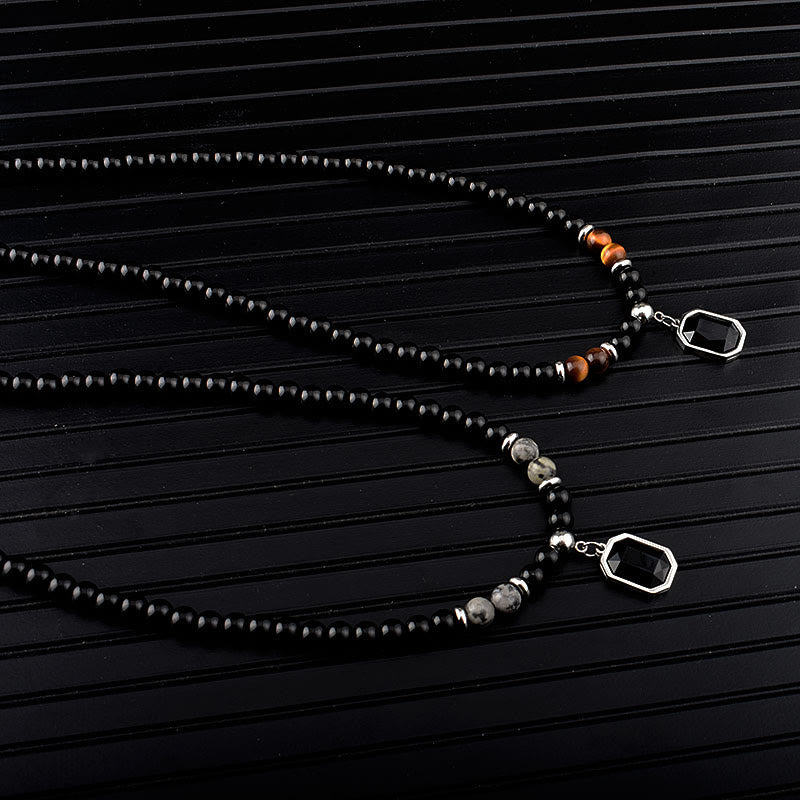 Collar de acero y titanio con cuentas de obsidiana y ojo de tigre para hombre de Olivenorma