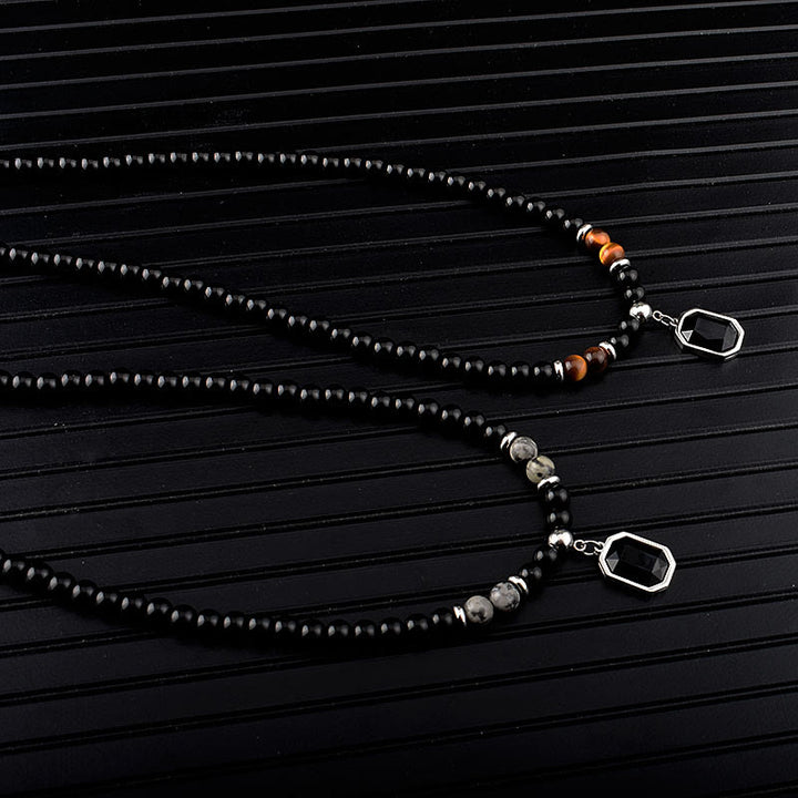 Collar de acero y titanio con cuentas de obsidiana y ojo de tigre para hombre de Olivenorma