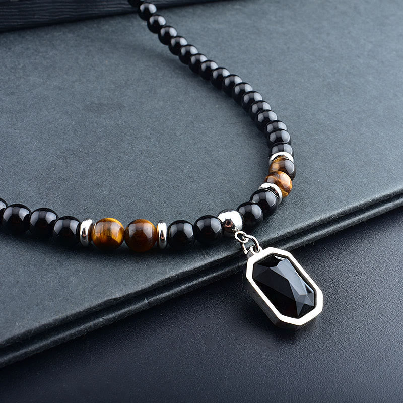 Collar de acero y titanio con cuentas de obsidiana y ojo de tigre para hombre de Olivenorma