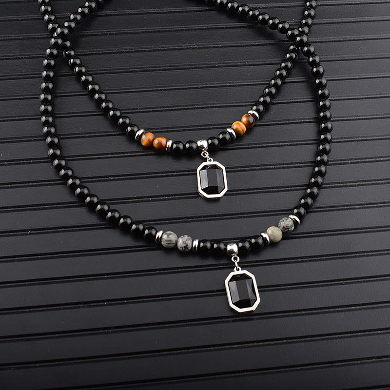 Collar de acero y titanio con cuentas de obsidiana y ojo de tigre para hombre de Olivenorma