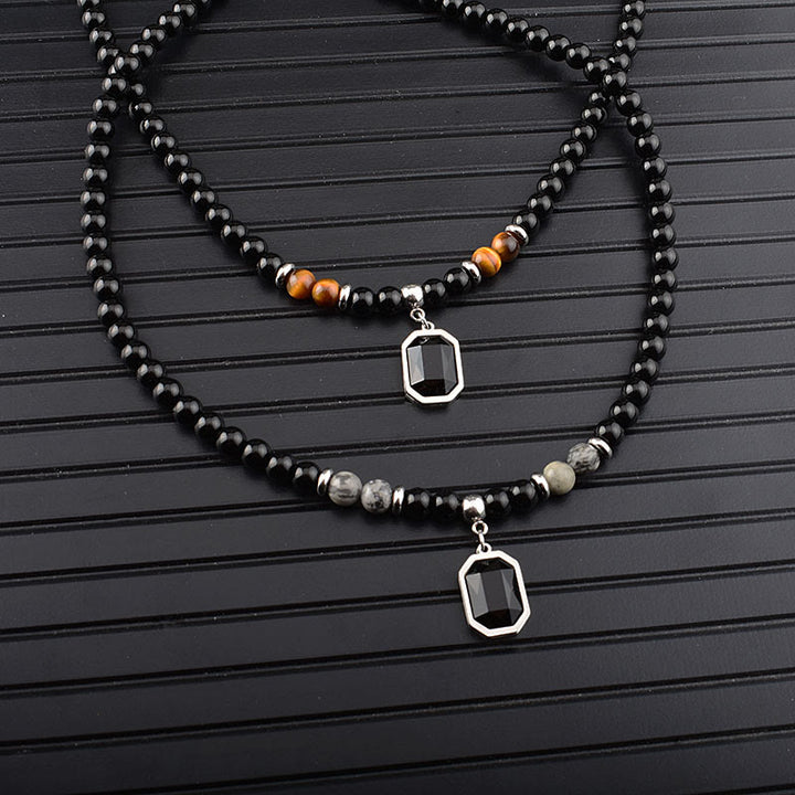 Collar de acero y titanio con cuentas de obsidiana y ojo de tigre para hombre de Olivenorma