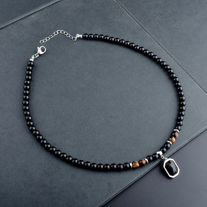 Collar de acero y titanio con cuentas de obsidiana y ojo de tigre para hombre de Olivenorma
