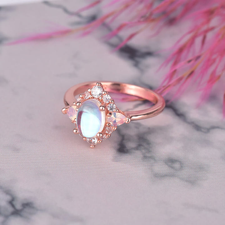 Anillo de mujer con ópalo, piedra lunar y circonita blanca de Olivenorma