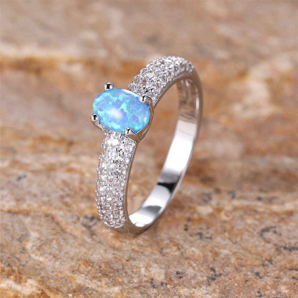 Anillo con borde de circonita y ópalo redondo "Shiny Elegance" de Olivenorma