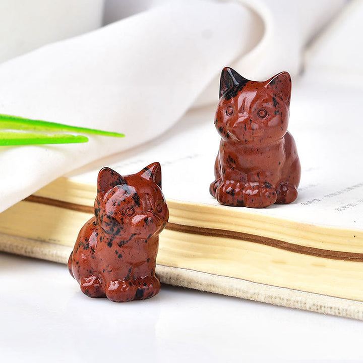 Artesanías con talladas de piedras preciosas y gatitos de cristal de Olivenorma.