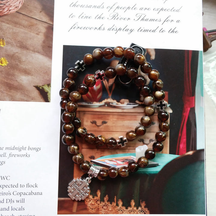 Pulsera rosario con colgante de cruz de ojo de tigre de Olivenorma