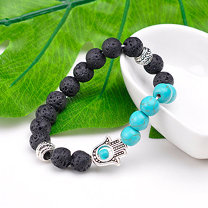 Pulsera con colgante de Hamsa y cuentas de piedra natural hecha a mano de Olivenorma