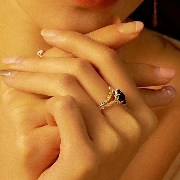Anillo de corona de doble hilera de circonitas blancas y arenisca azul de Olivenorma