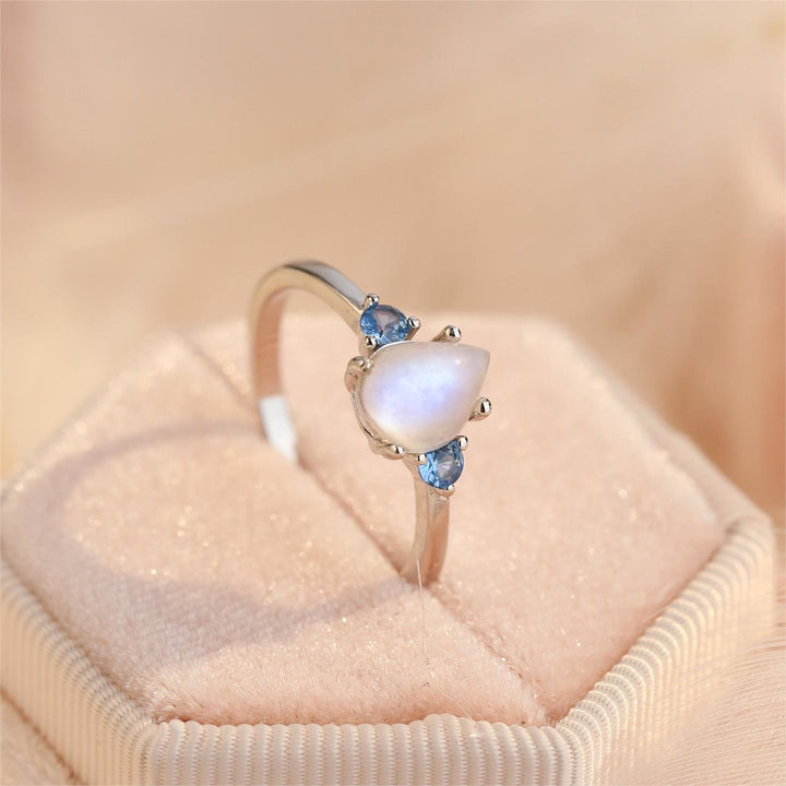Anillo de plata de ley S925 con topacio azul y piedra lunar de Olivenorma