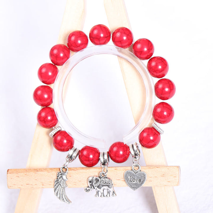 Juego de pulseras con cuentas y colgante de corazón con alas de elefante de Olivenorma 