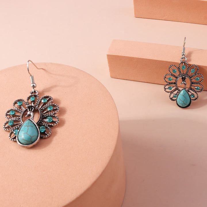 Pendientes colgantes en forma de pavo real con turmalina Paraiba y turquesa de Olivenorma