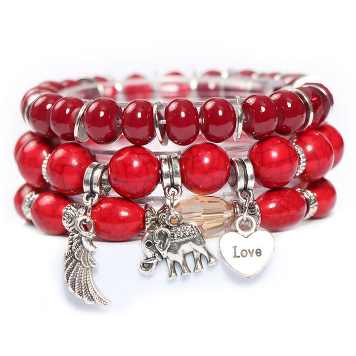 Juego de pulseras con cuentas y colgante de corazón con alas de elefante de Olivenorma 