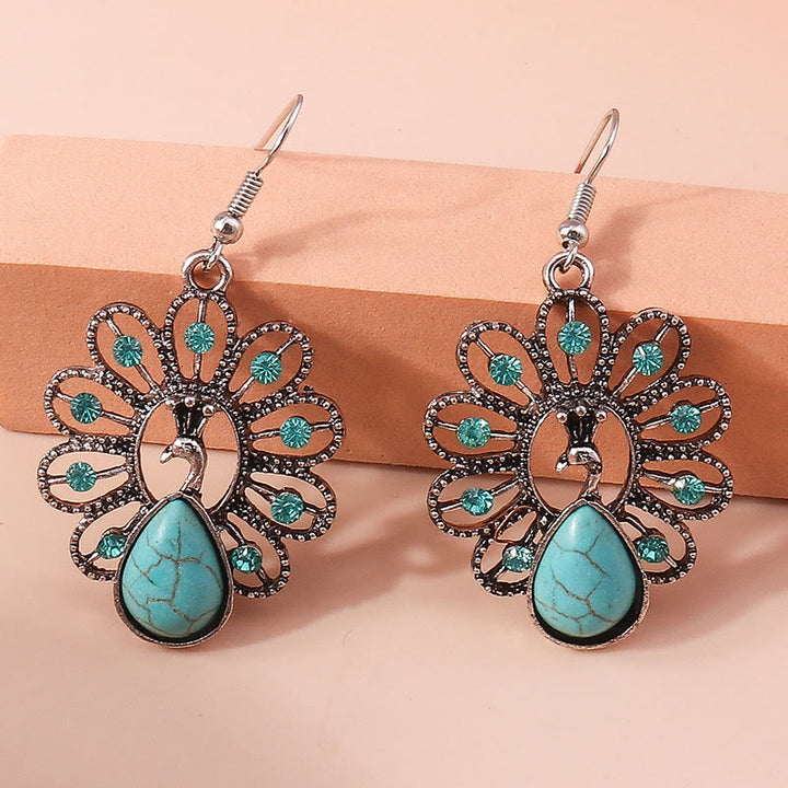 Pendientes colgantes en forma de pavo real con turmalina Paraiba y turquesa de Olivenorma
