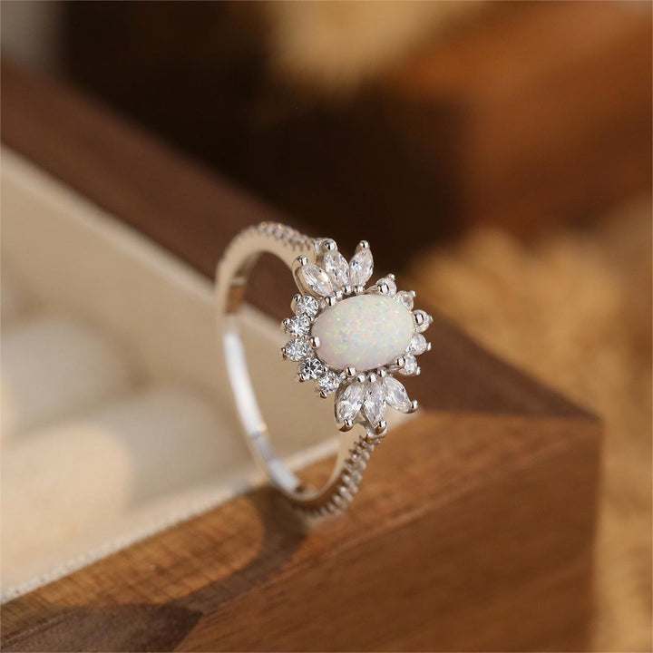 Anillo de plata 925 con diseño de girasol y ópalo azul blanco de Olivenorma 