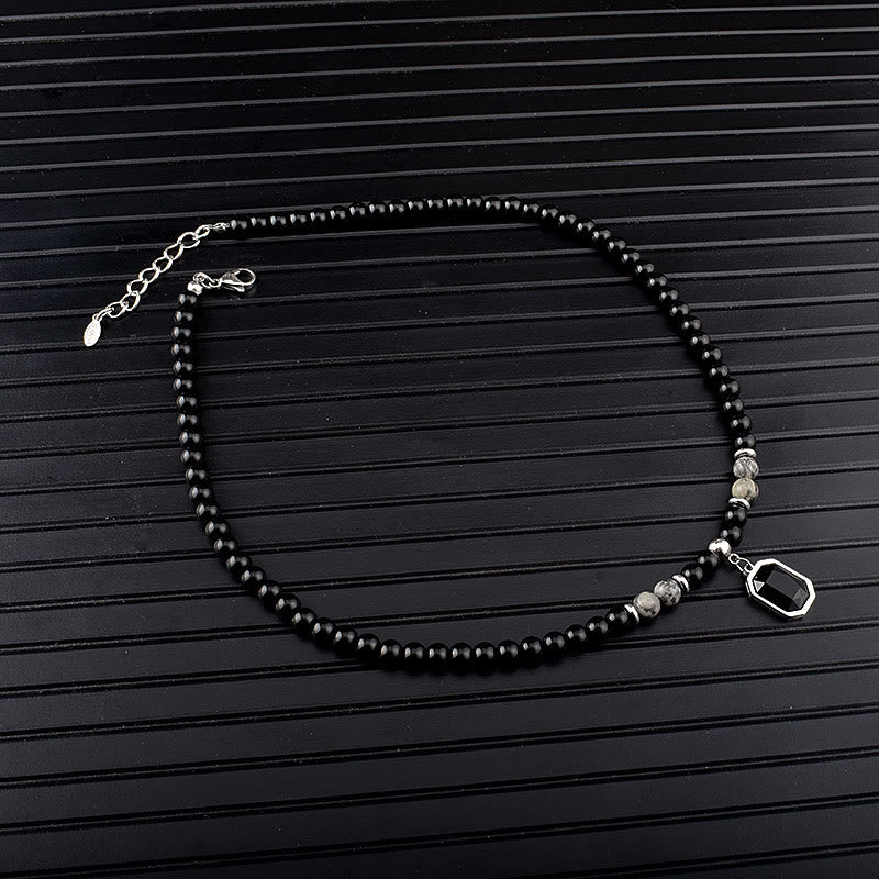 Collar de acero y titanio con cuentas de obsidiana y ojo de tigre para hombre de Olivenorma