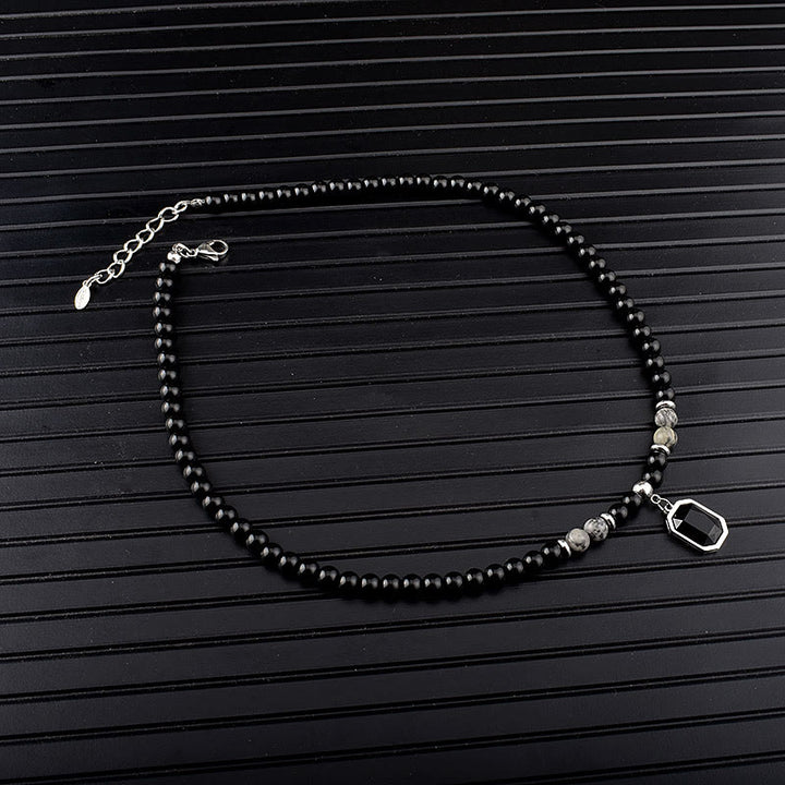 Collar de acero y titanio con cuentas de obsidiana y ojo de tigre para hombre de Olivenorma