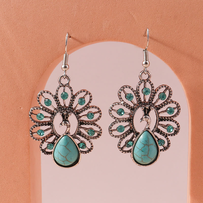 Pendientes colgantes en forma de pavo real con turmalina Paraiba y turquesa de Olivenorma