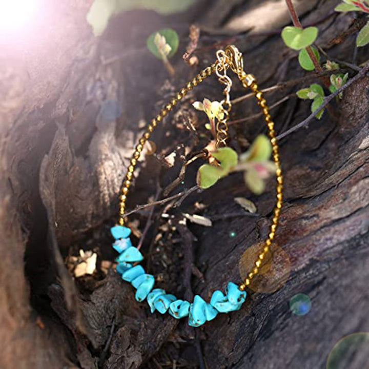 Pulsera de cuentas turquesas con cadena dorada de Olivenorma 