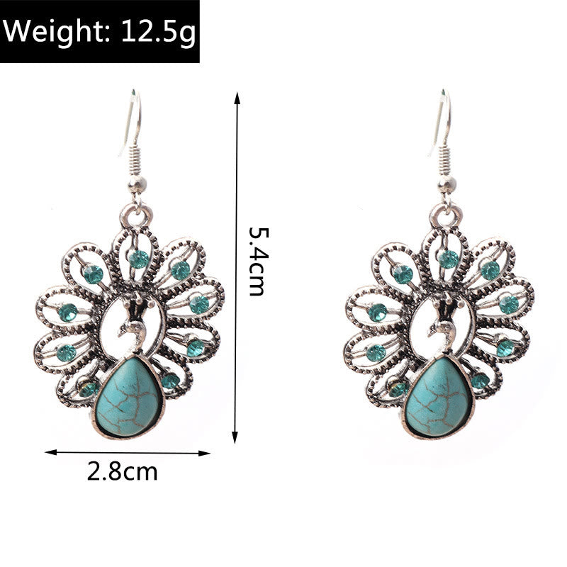 Pendientes colgantes en forma de pavo real con turmalina Paraiba y turquesa de Olivenorma